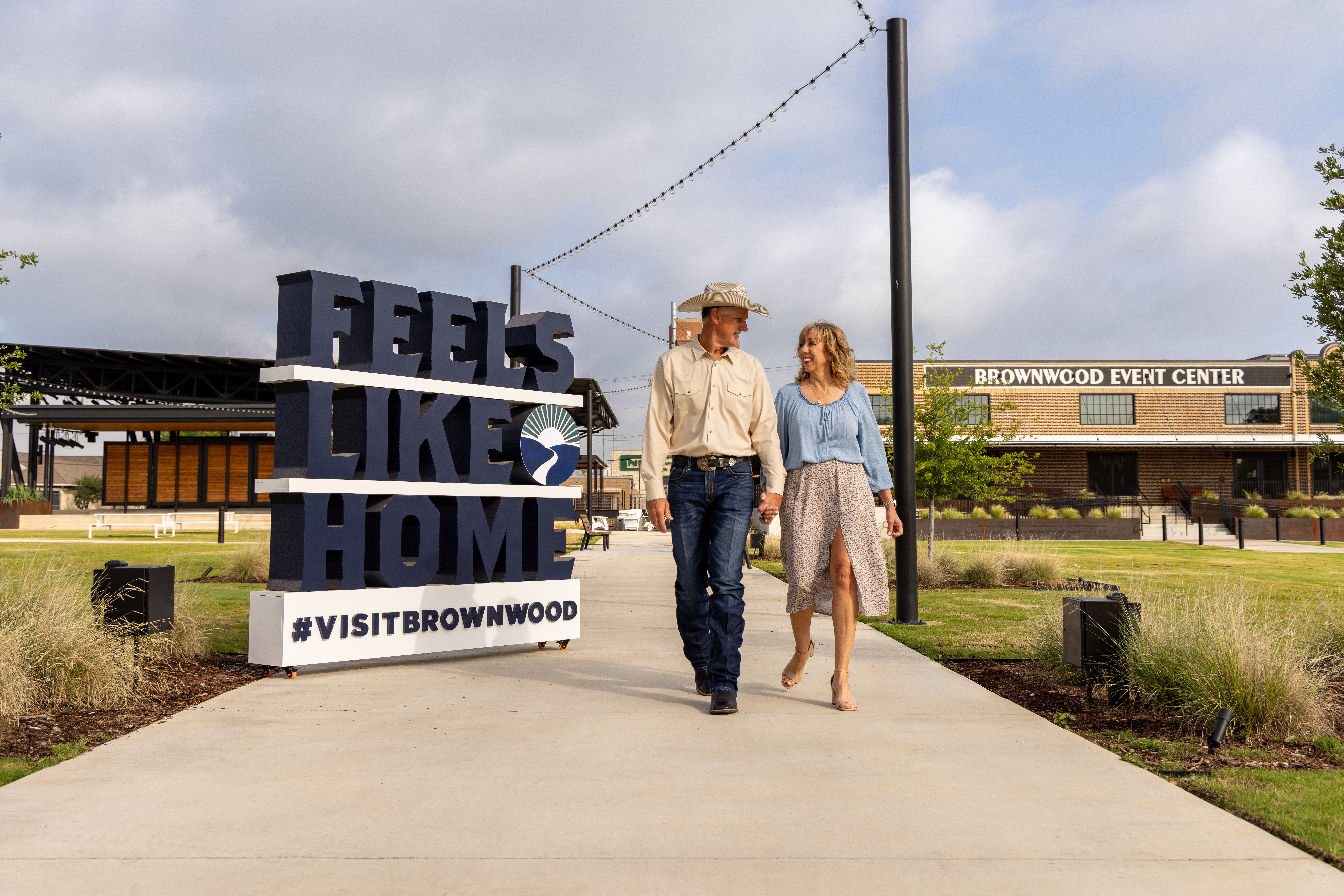 Couple walking by Brownwood Event Center